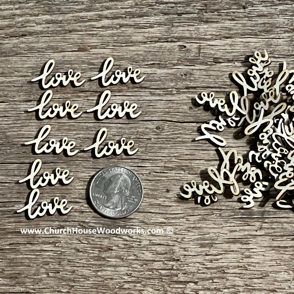A close-up of 50 small cursive "love" wood letters arranged next to a quarter for size reference, showcasing their natural wood texture and compact dimensions. Perfect for wedding decorations, DIY crafts, and rustic-themed projects.