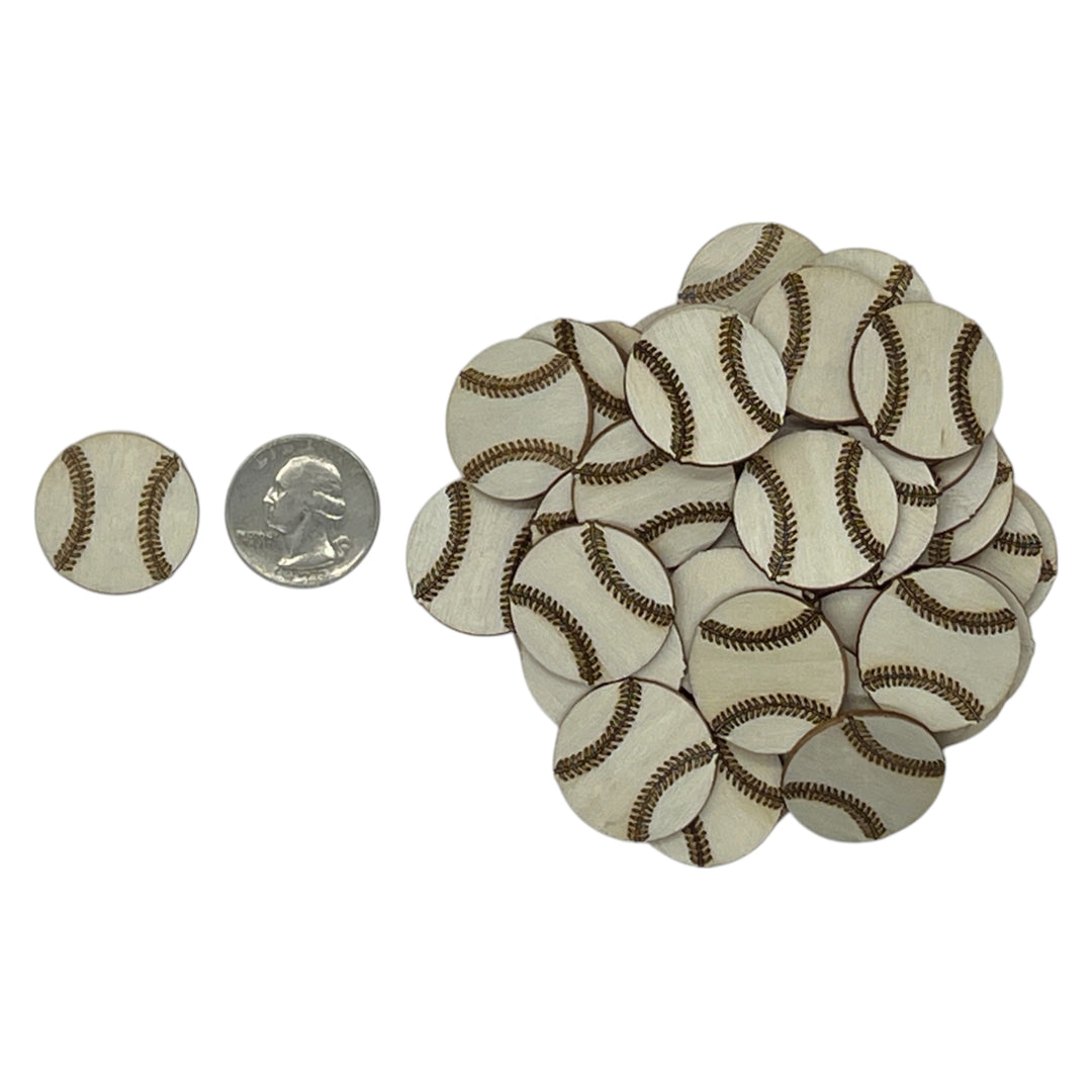 Small laser cut wood baseballs with a quarter for scale on a white background