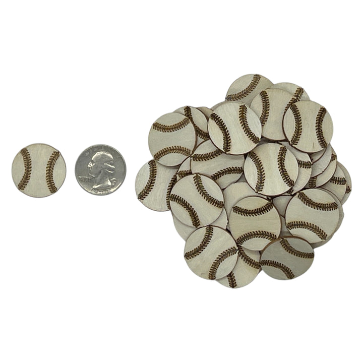 Small laser cut wood baseballs with a quarter for scale on a white background