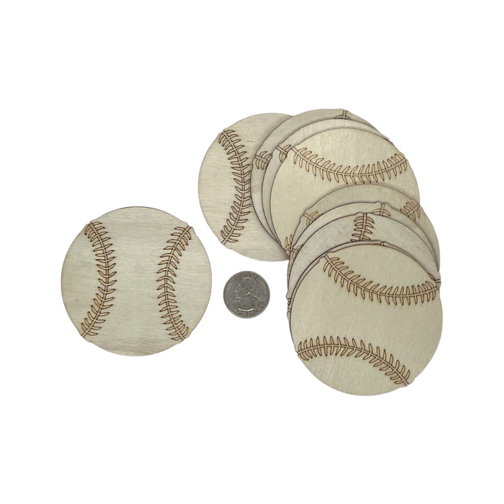 Set of round beige coasters with baseball pattern and a coin for scale on a white background