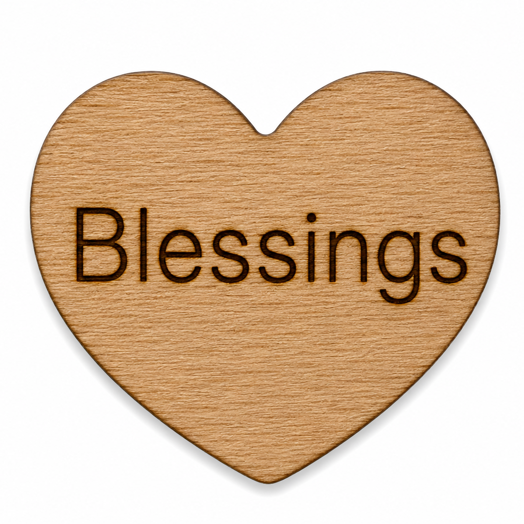 Wooden heart with the word BLESSINGS on the front of it for handing out to people for engouement. 