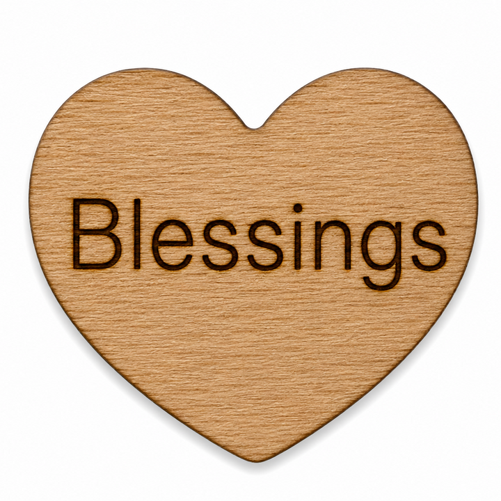 Wooden heart with the word BLESSINGS on the front of it for handing out to people for engouement. 