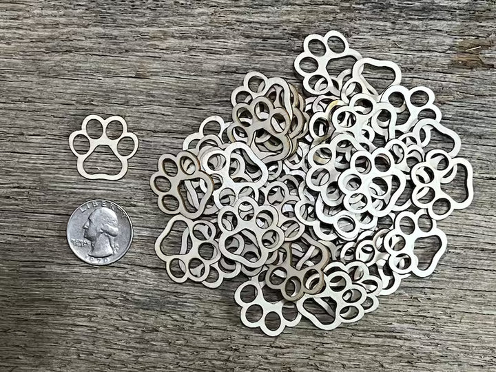 laser cut paw print design on a wooden surface 