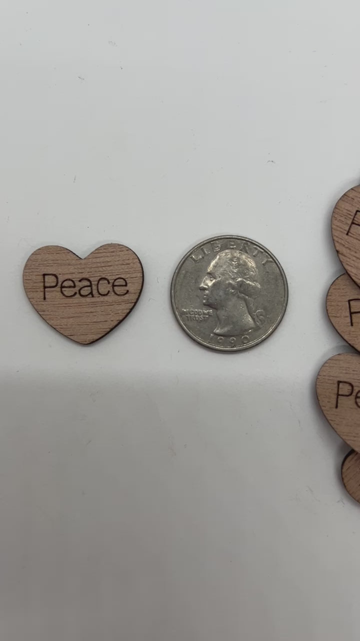 1 inch wood hearts with the word peace on them confetti